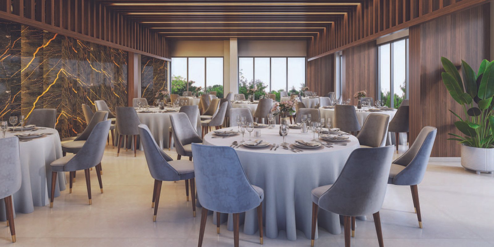 Elegant banquet hall with marble feature wall at Emami Aamod