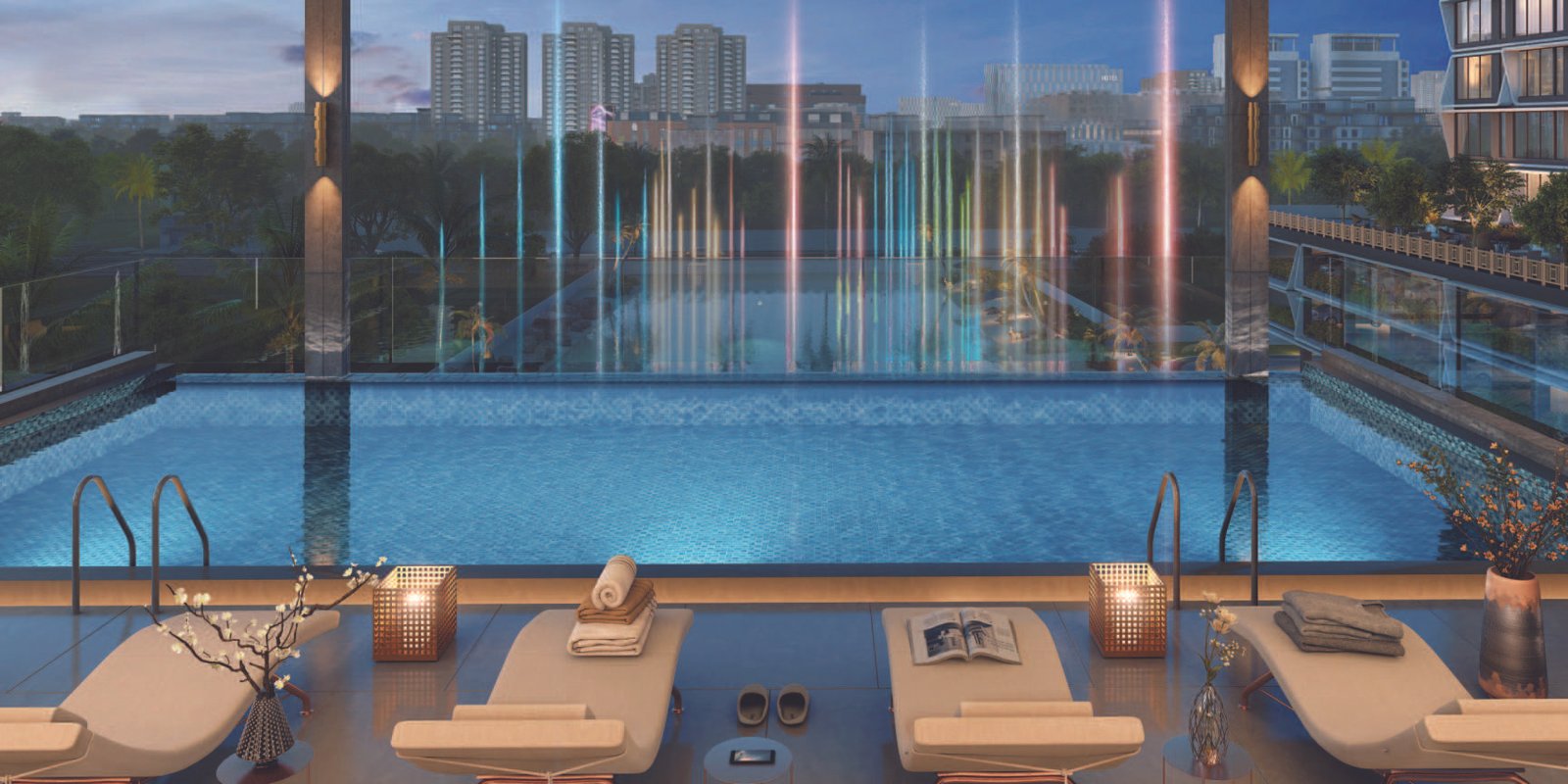 Infinity edge swimming pool cantilevered over the musical fountain lake at Emami Aamod